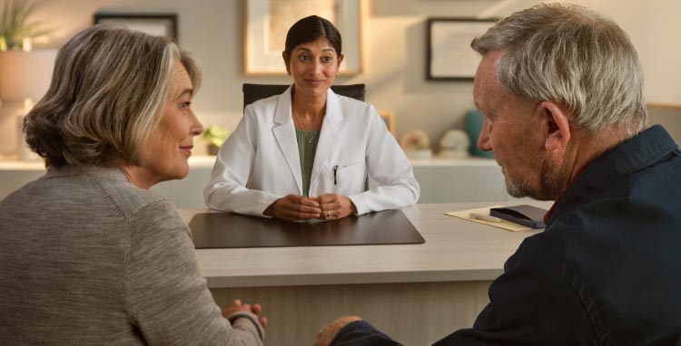 Patient and wife in doctor’s office. Actor portrayal
